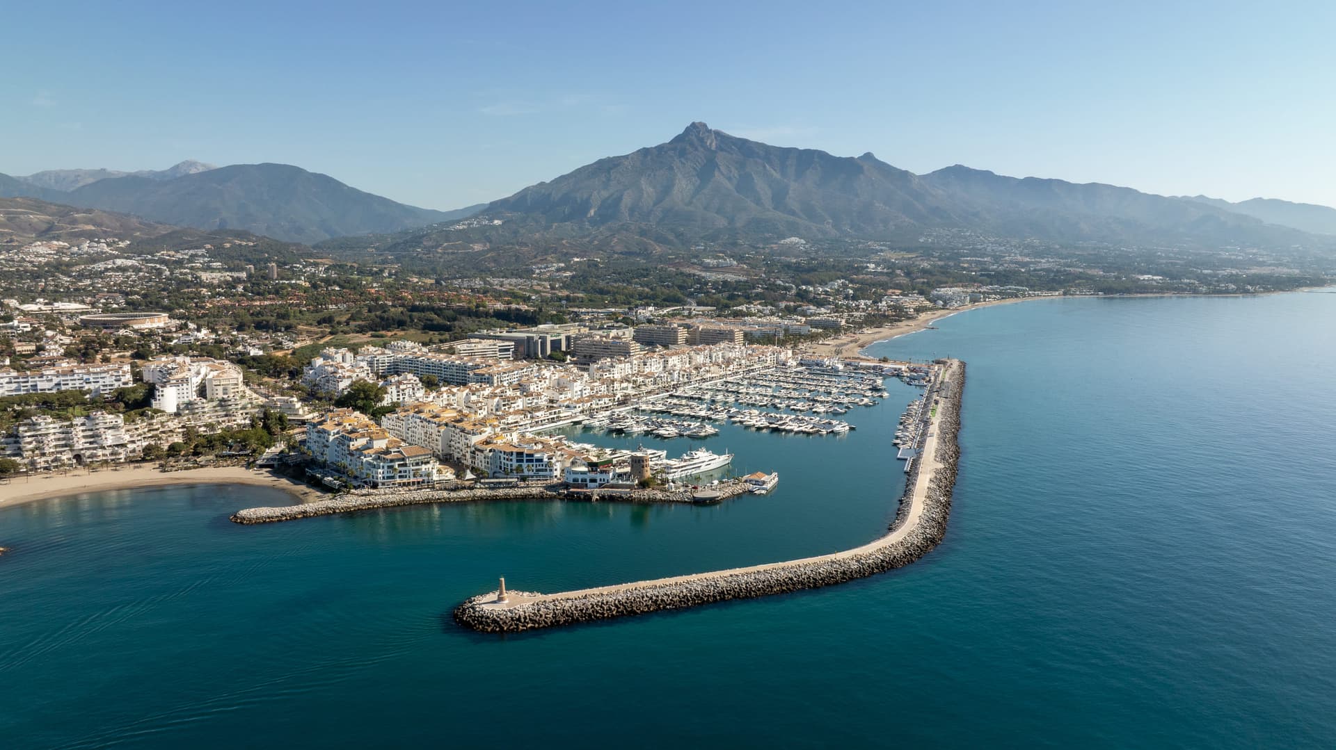 Aerial view of the marina at Puerto Banús, with the beach alongside and La Concha mountain behind